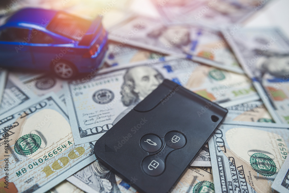 blue toy car with key over us money blue toy car with key over us money