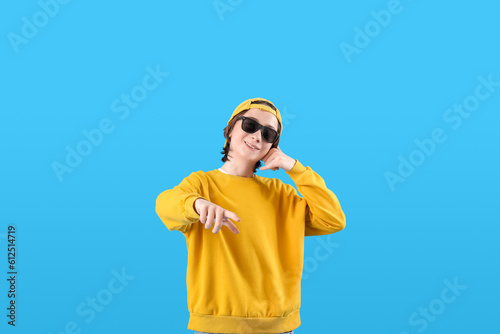 Cool teenage boy showing "c...