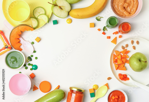 Frame made of healthy baby food, fresh, vegetables and dishware on white background
