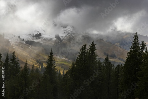 Dramatic ambiance of white clouds over the Gantrisch Mountain in Swiss Alps