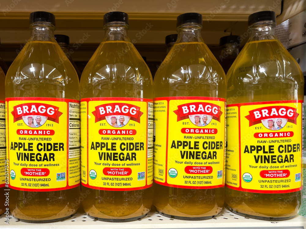 atlanta-georgia-june-12-2023-bottles-of-bragg-organic-raw-apple