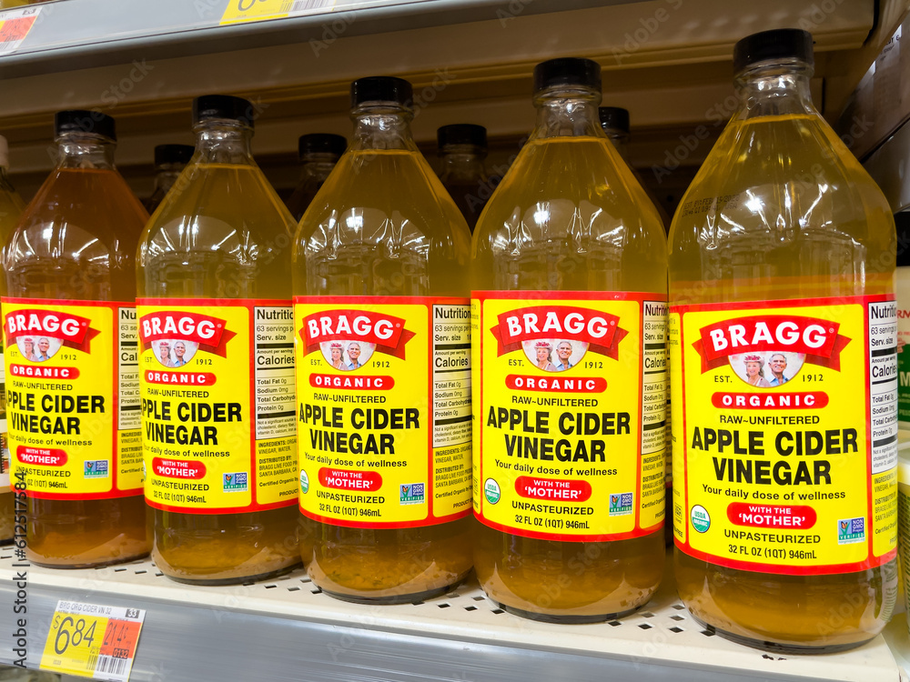 atlanta-georgia-june-12-2023-bottles-of-bragg-organic-raw-apple