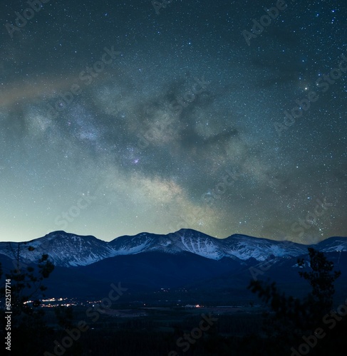 Beautiful scene of vista Starry night sky over the rocky mountains, for wallpaper