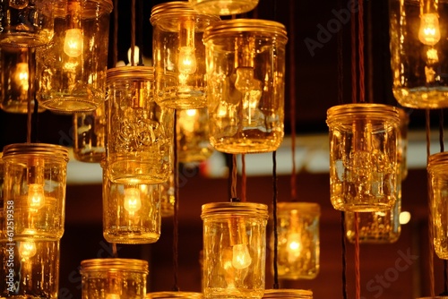 Closeup of the lit lamps in the jars against the dark blurred background