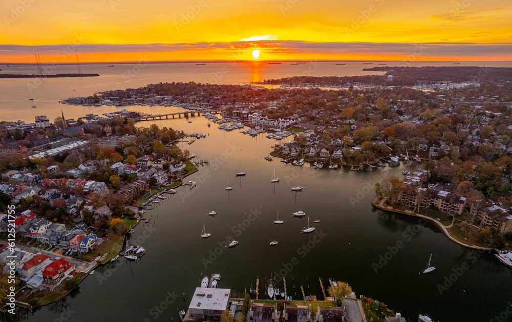Aerial shot of Annapolis harbor and Chesapeake Bay at sunset. - obrazy, fototapety, plakaty 