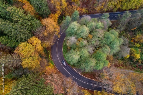 Aerial view of a highway with colorful trees around in Solingen in Germany © Azurepicnrw/Wirestock Creators