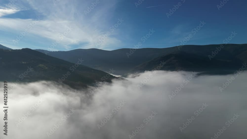 4K Drone Video Flying Over Clouds in Mountain at Sunrise with colorful sky