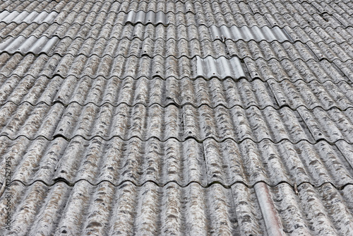 Old Asbestos cement roofing sheets, Asbestos roof, Corrugated Asbestos Cement Roof Sheet, corrugated panels, Gray slate texture, Gray wavy slate roof pattern background.