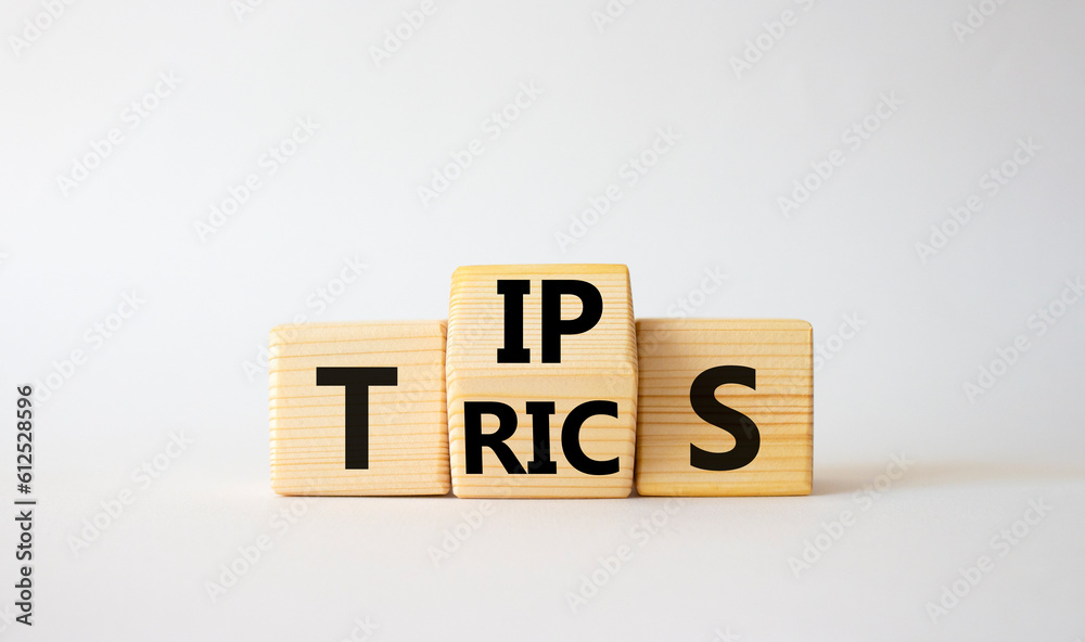 Tips and Tricks symbol. Wooden cubes with words Tricks and Tips. Beautiful white background. Business and Tips and Tricks concept. Copy space Tips and Tricks symbol. Wooden cubes with words Tricks and Tips. Beautiful white background. Business and Tips and Tricks concept. Copy space