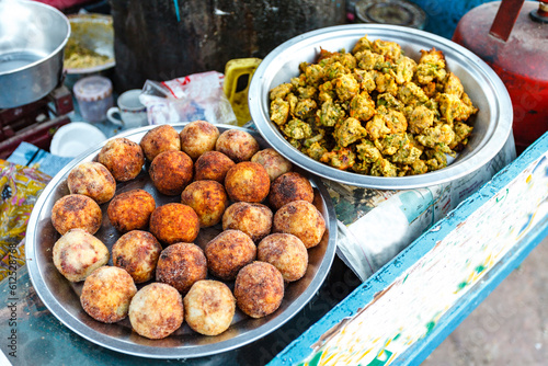Local Indian food, Indian doughnuts and Rajasthan vegatarian dish on a market in Jodhpur, Rajasthan, India, Asia
