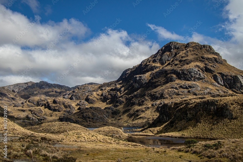 Beautiful view of the rocky mountains and a lake in the El Cajas National Park, Ecuador.