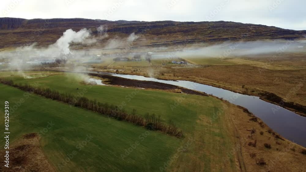 River and smoke in grasslands of east Iceland during October. River and smoke in grasslands of east Iceland during October.