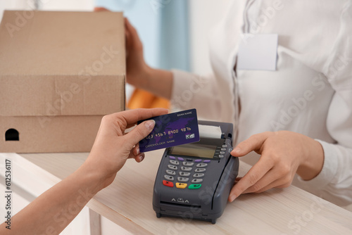 Female customer paying for ...