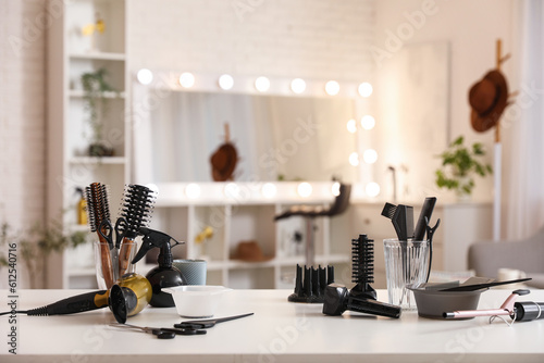 Canvas Print Different hairdressing tools on table in beauty salon