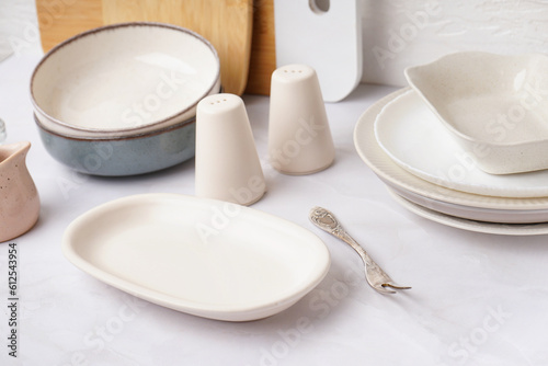 Set of stylish tableware on white background