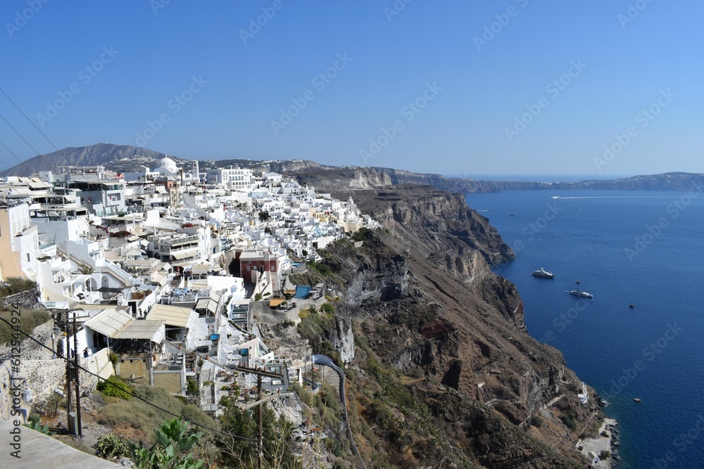 Aerial view of the white buildings of Santorini island in Greece overlooking the Aegean Sea
