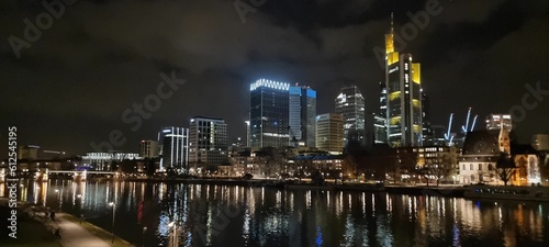 Cityscape of Frankfurt at night with a cloudy sky in the background, Germany