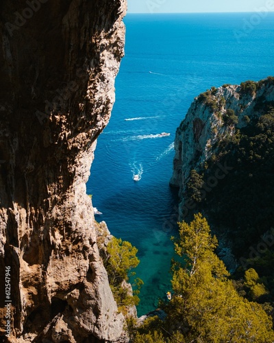 Photography High-angle shot of a speedboat cruising in between the islands of Capri in the G