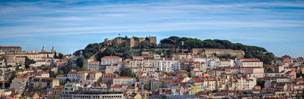 Panoramic shot of residential buildings of Lisbon with the Saint George's Castle on the background