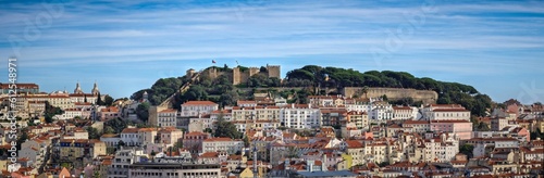 Panoramic shot of residential buildings of Lisbon with the Saint George's Castle on the background