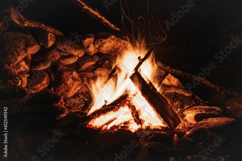 Closeup shot of a warm campfire burns hot with wood on a cold winter night