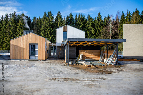 Image of Unfinished scandinavian style wooden house and parking © AvokadoStudio