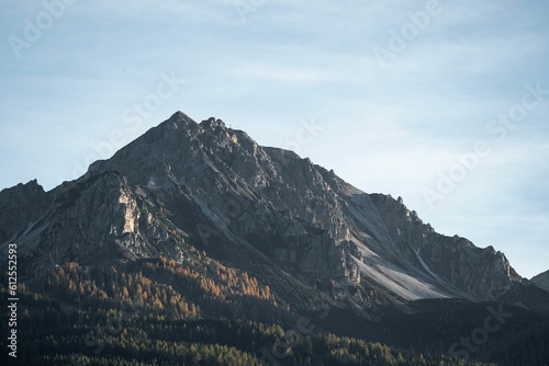 Beautiful view of the rocky mountain peak and forest.