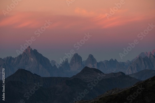 Silhouette of mountains under colorful sky during sunset