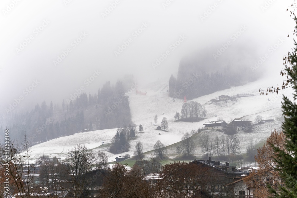 Rural winter landscape on a foggy day in Kitzbuhel, Austria