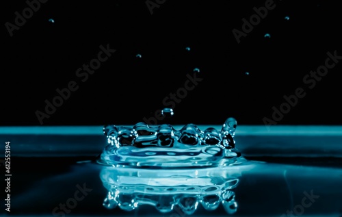 Water bubbles and drops isolated on a dark background in blue tones