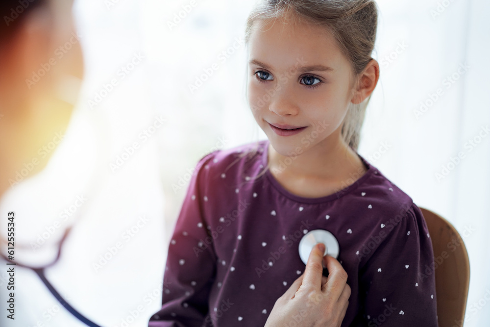 Happy smiling child girl patient at usual medical inspection. Doctor and kid patient at home. Medicine, healthcare concepts. Happy smiling child girl patient at usual medical inspection. Doctor and kid patient at home. Medicine, healthcare concepts.
