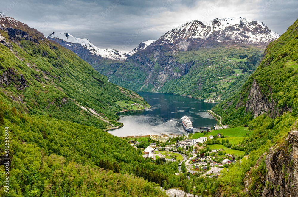 Beautiful fjord Geiranger waterway in Norway. Important travel channel for boats and cruise ships to get to cities through beautiful nature. 