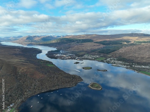 Drone view of a beautiful lake near the mountains in Scotland