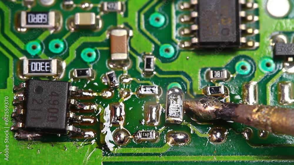 Melting solder. As the resin core tin/lead (60/40) solder