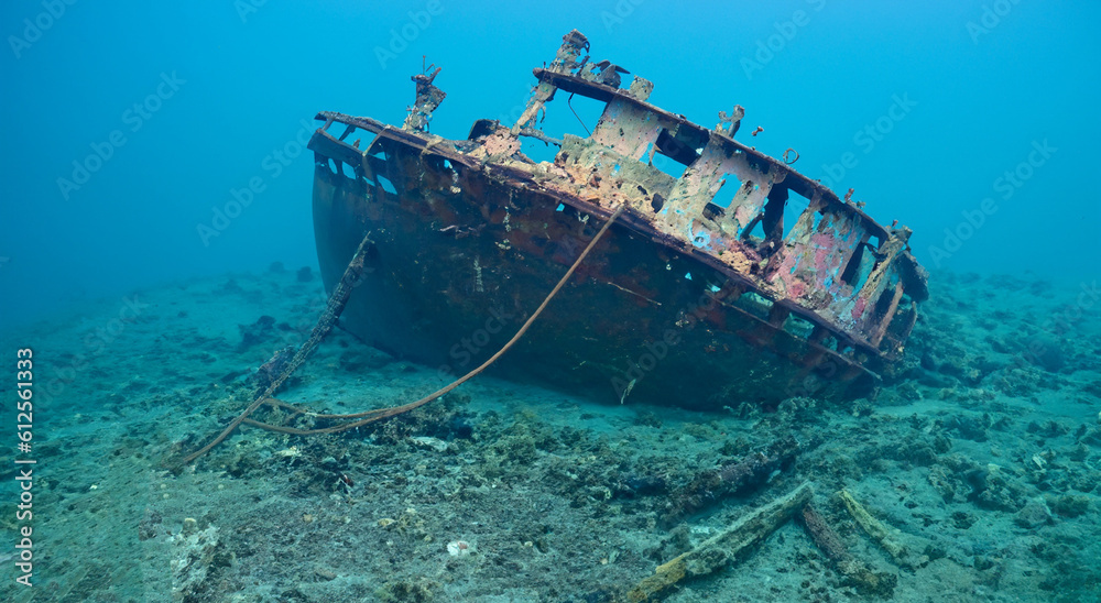 destroyed ship under the deep sea in the sand