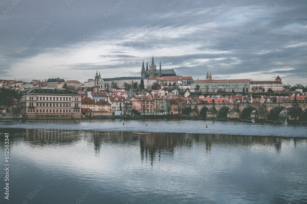 The cityscape of Prague, Czech Republic, on a cloudy winter day, with the Vltava River coast