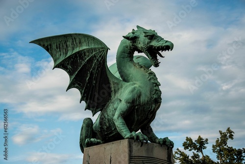 Close-up shot of a scary dragon statue in Slovenia