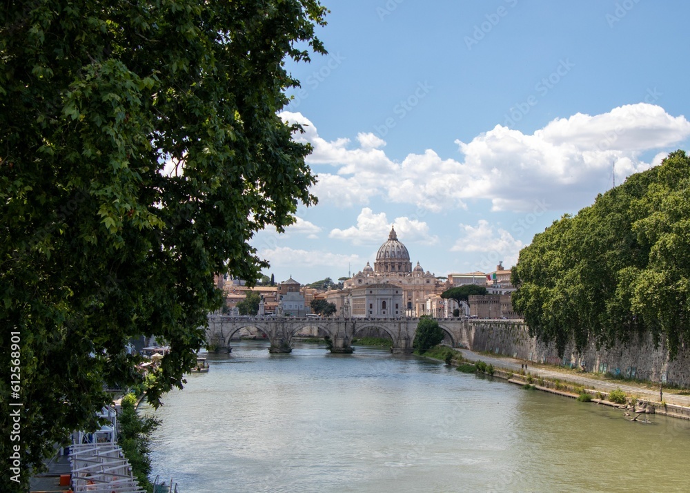 Beautiful view of St. Peter's Basilica with the river crossing the city. Vatican