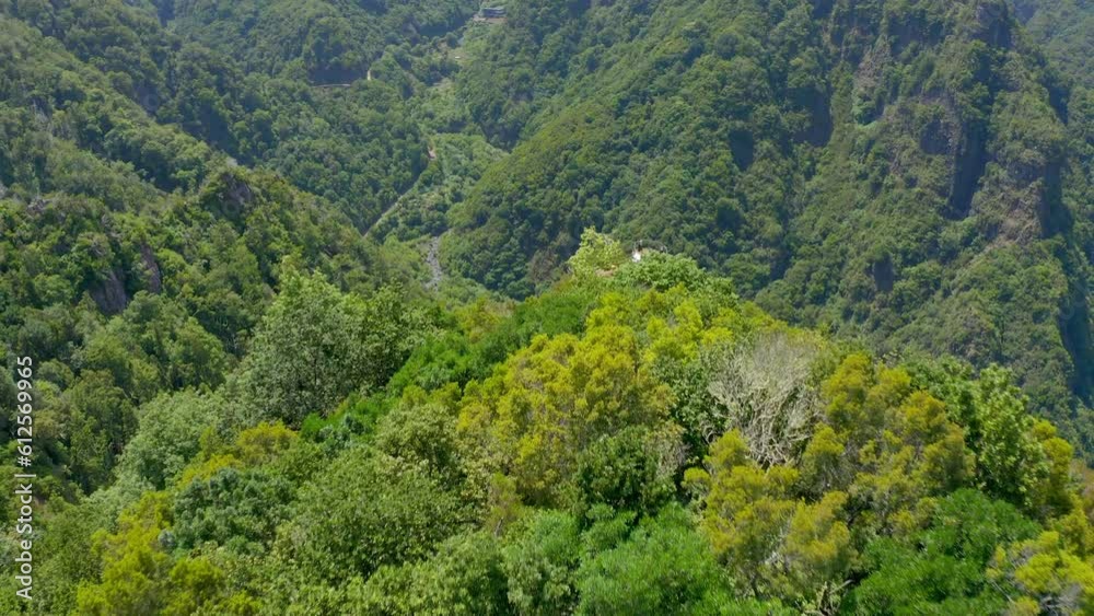Aerial shot of mountains and valleys with an overview deck on the island of Madeira in Portugal Aerial shot of mountains and valleys with an overview deck on the island of Madeira in Portugal