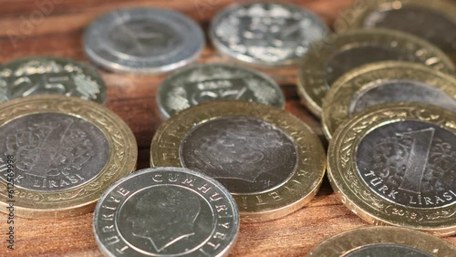 Turkish TL coins. Camera motion over distributed coin money. Inflation jumps to 19-year high in end of last year amid lira swoon. Close up panning video Perfect for financial commerce treasury or bank