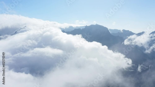 Breathtaking view of white clouds over Encumeada, Madeira Islands photo