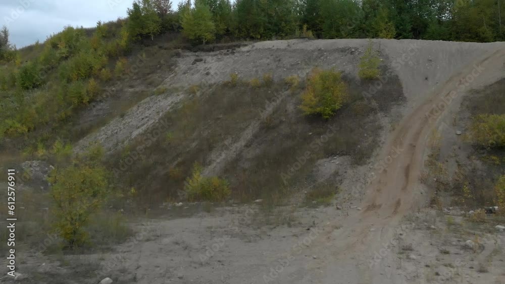 Drone view over trees growing on a stone quarry Drone view over trees growing on a stone quarry