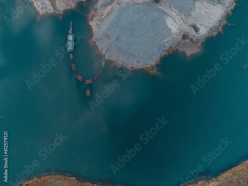 Aerial shot of a parked port in the water in the shore