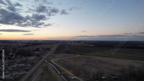 Aerial footage of green fields during a colorful sunset in Itta Bena, Mississippi photo