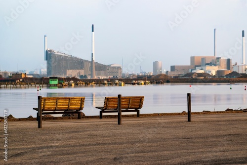 Lakeside benches against the Amager Bakke heat and power energy plant in Copenhagen, Denmark photo