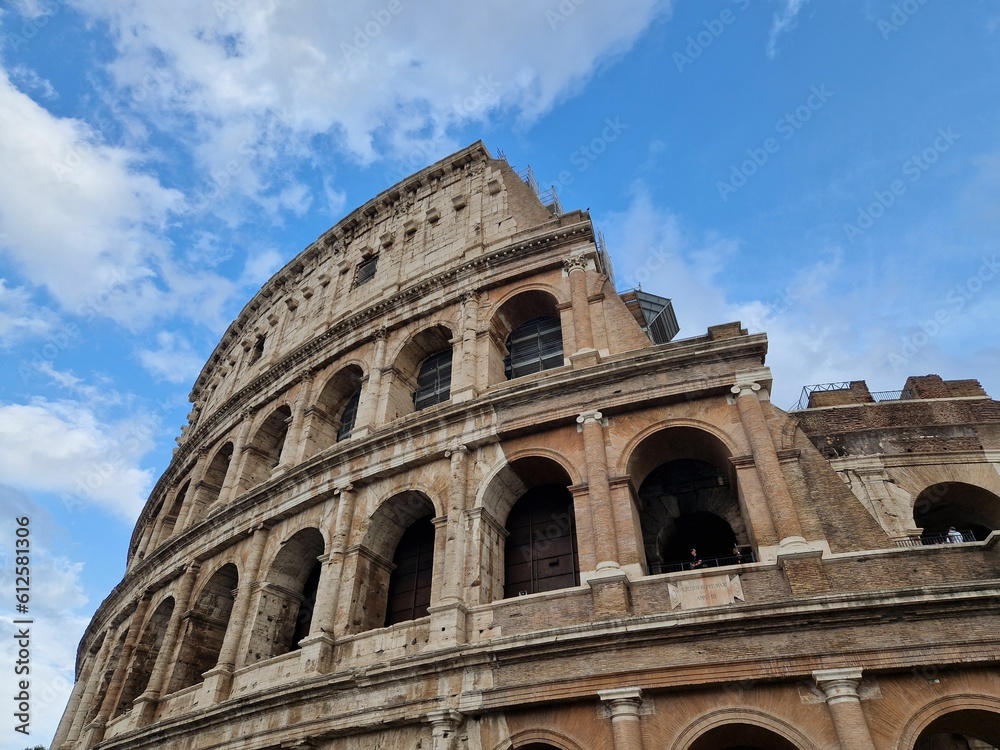 Famous Colosseum against the blue sunny sky in Rome, Italy