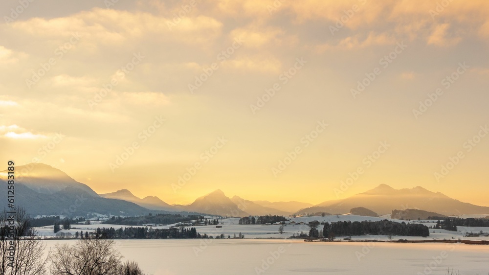 Scenic view of calm coast and mountainous islands during sunset Scenic view of calm coast and mountainous islands during sunset