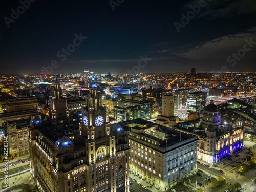 Aerial view of the Liverpool cityscape at night with illuminated streets and buildings