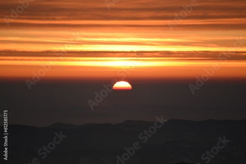 Mesmerizing sunset over the silhouette of the hills