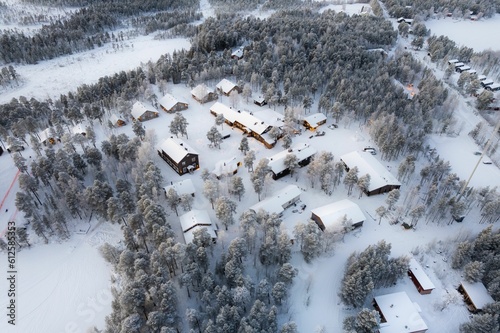 Beautiful view of snowy village with small houses and trees